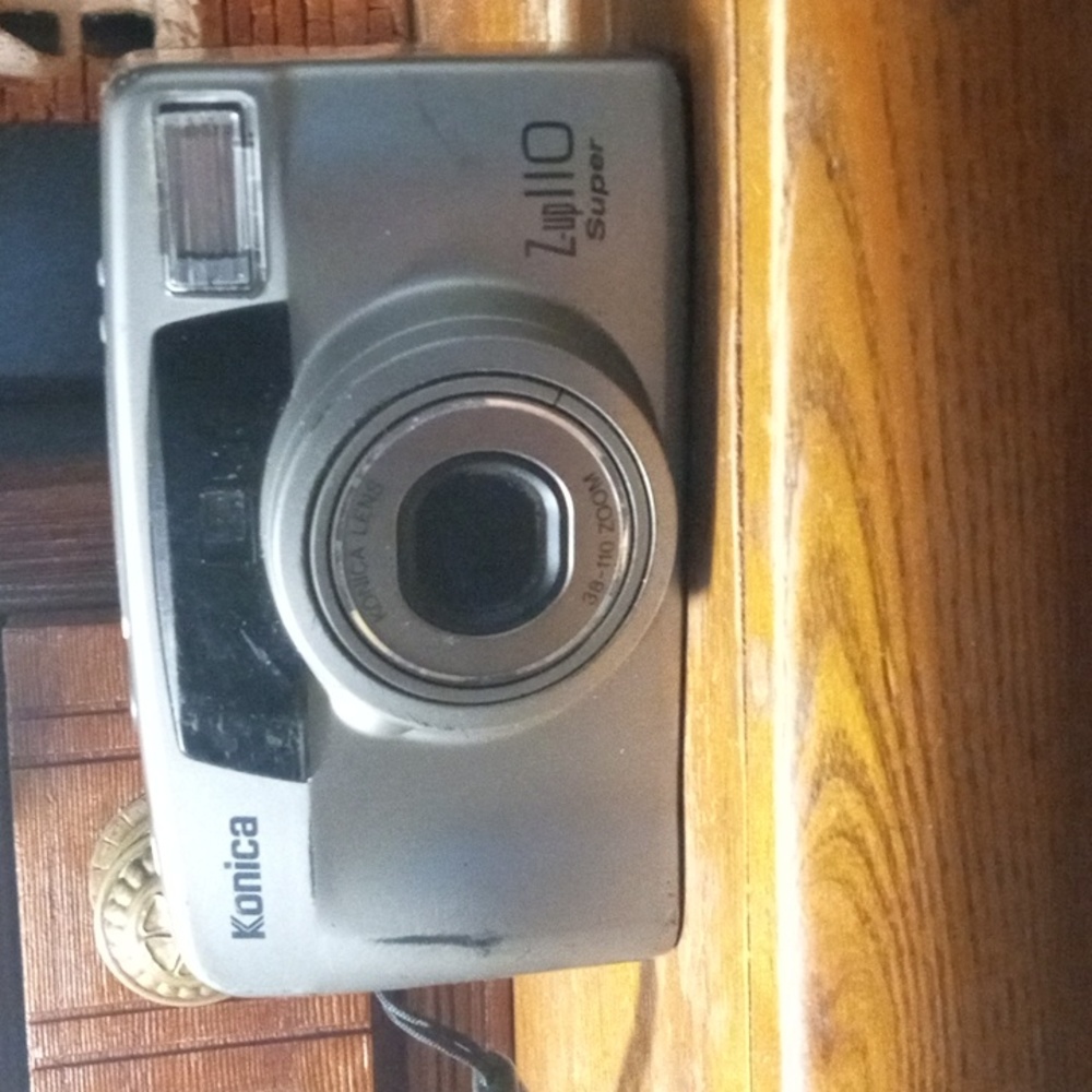Vintage Konica Z up 110.super 35 mm Camera with flash and zoom lens.